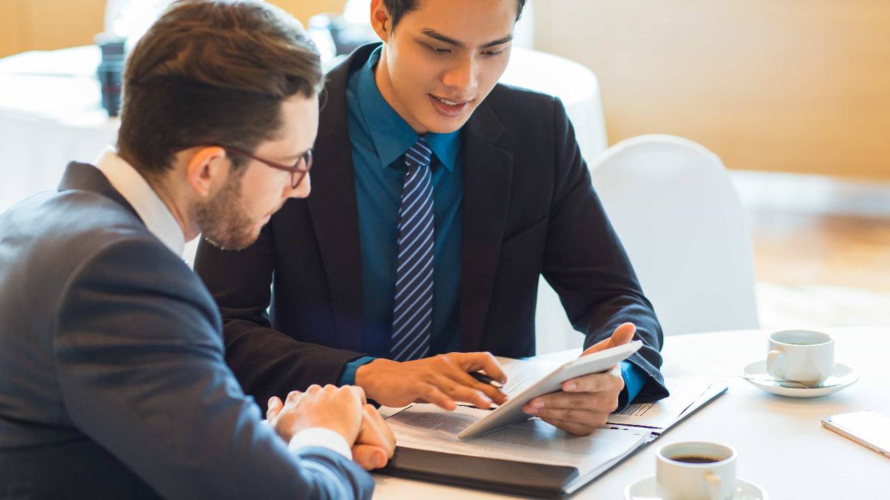 two content business partners discussing issue